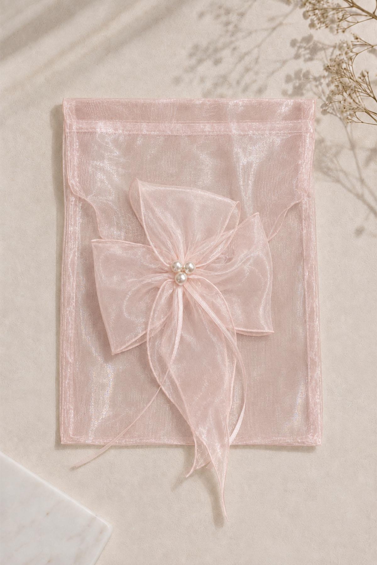 Sac cadeau orné de fleurs de perles